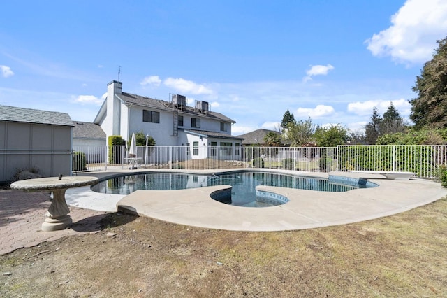 view of swimming pool featuring a fenced in pool, a fenced backyard, and a patio