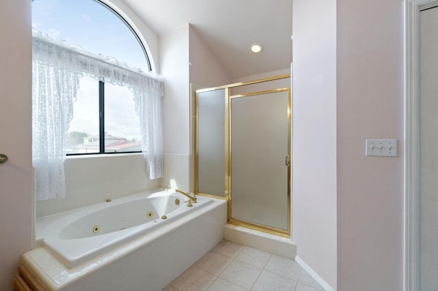 full bath with a stall shower, tile patterned flooring, and a wealth of natural light