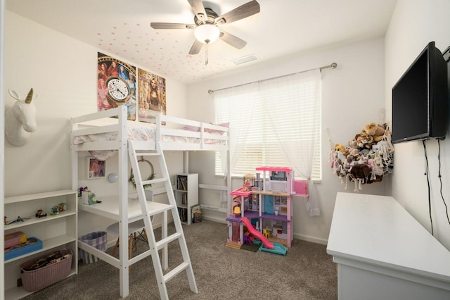 carpeted bedroom with baseboards, visible vents, and a ceiling fan