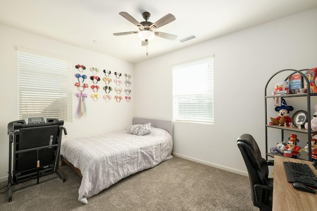 bedroom featuring ceiling fan, carpet, visible vents, and baseboards