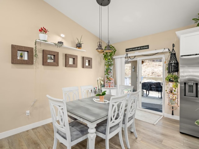 40023 Woodsong Way, Oakhurst, CA 93644 - dining area featuring lofted ceiling, light wood-style floors, and baseboards