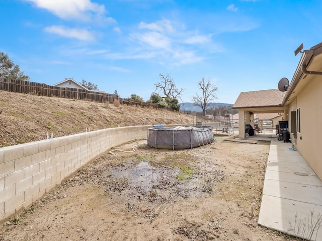 40023 Woodsong Way, Oakhurst, CA 93644 - view of yard featuring a fenced in pool and fence