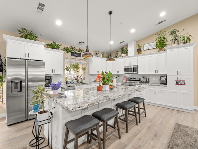 40023 Woodsong Way, Oakhurst, CA 93644 - kitchen with stainless steel appliances, a sink, visible vents, and white cabinets