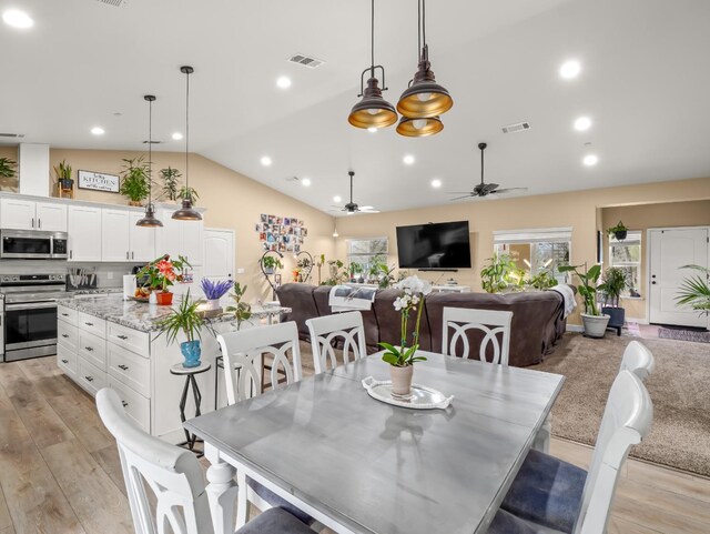 40023 Woodsong Way, Oakhurst, CA 93644 - dining area featuring light wood-style flooring, visible vents, vaulted ceiling, and recessed lighting