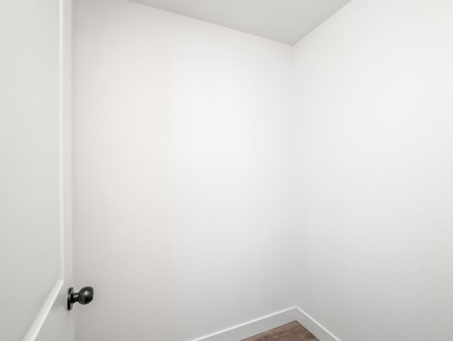 40023 Woodsong Way, Oakhurst, CA 93644 - washroom with dark wood finished floors and baseboards