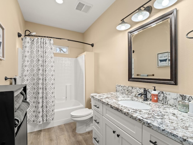 40023 Woodsong Way, Oakhurst, CA 93644 - bathroom with shower / tub combo, visible vents, toilet, wood finished floors, and vanity