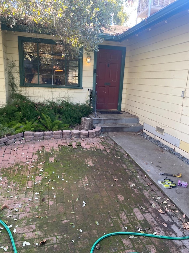 doorway to property featuring crawl space