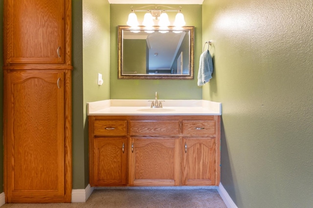 bathroom with vanity and baseboards