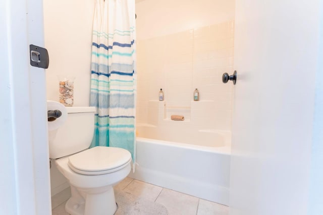 full bath with tile patterned flooring, shower / tub combo, and toilet