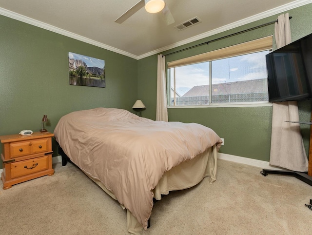 bedroom with light colored carpet, visible vents, ornamental molding, a ceiling fan, and baseboards