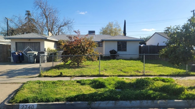 ranch-style house with driveway, a front lawn, and a fenced front yard