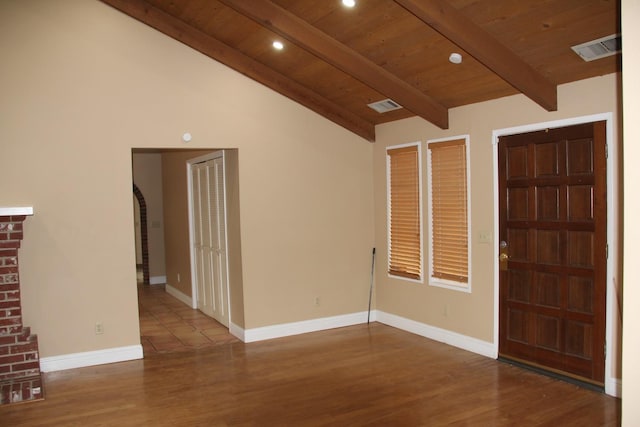 foyer with wooden ceiling, visible vents, lofted ceiling with beams, and baseboards