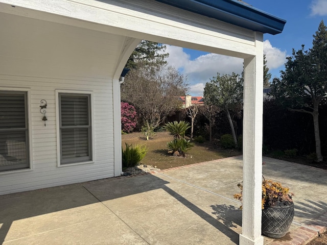 view of patio featuring fence