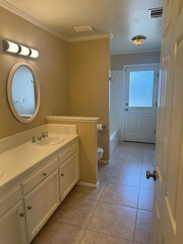 bathroom with visible vents, toilet, ornamental molding, tile patterned flooring, and vanity