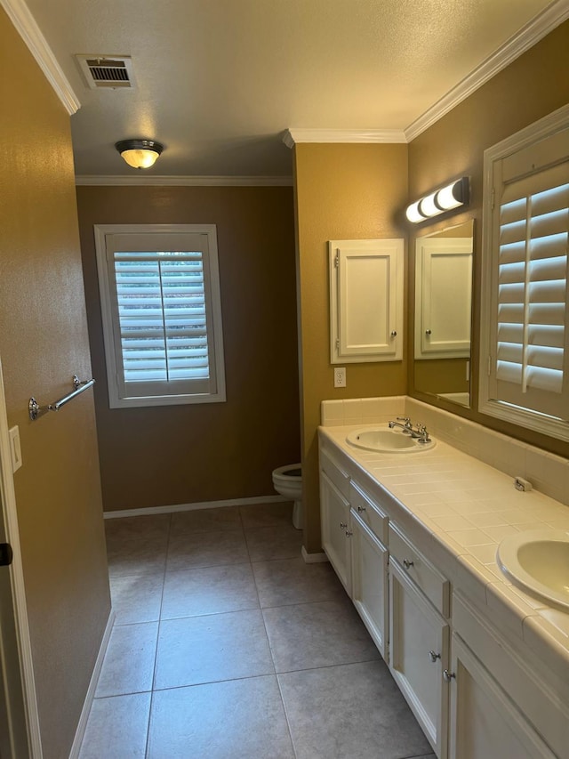 full bathroom with baseboards, visible vents, ornamental molding, tile patterned flooring, and a sink