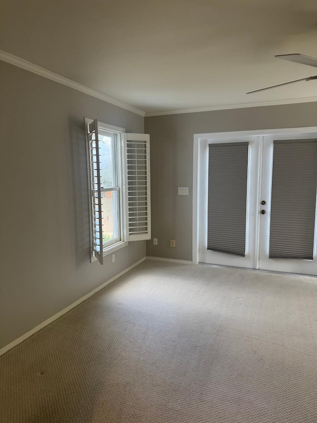 unfurnished bedroom featuring carpet, a closet, baseboards, and crown molding