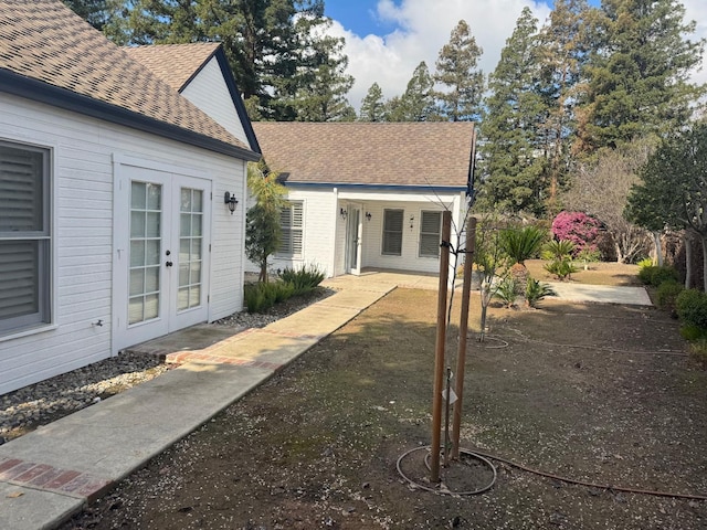 view of yard featuring french doors