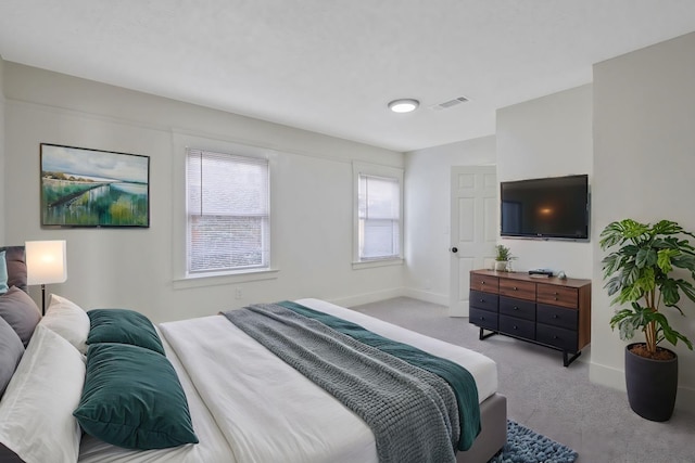 bedroom featuring carpet, visible vents, and baseboards