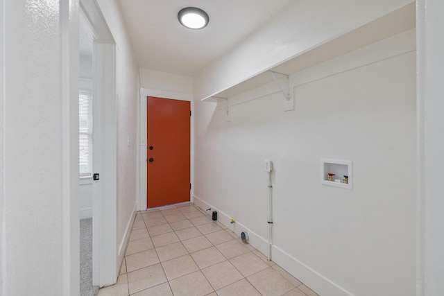 laundry room featuring laundry area, baseboards, hookup for a gas dryer, washer hookup, and light tile patterned flooring