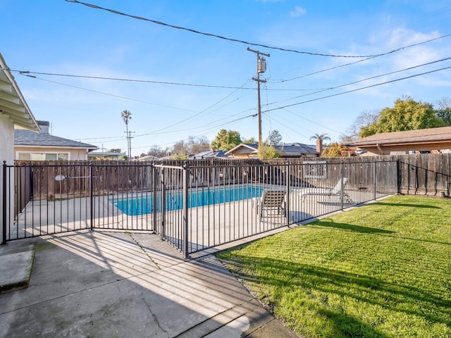 view of swimming pool featuring a patio area, a fenced backyard, a fenced in pool, and a lawn