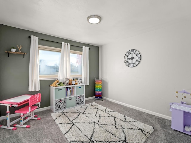 playroom with carpet floors and baseboards