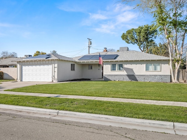 ranch-style home with brick siding, stucco siding, an attached garage, driveway, and a front lawn