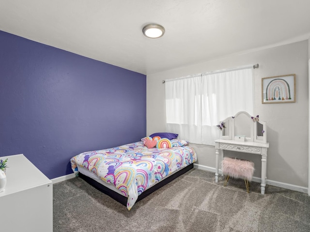 carpeted bedroom featuring baseboards