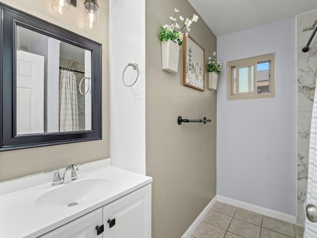 bathroom with baseboards, curtained shower, vanity, and tile patterned floors