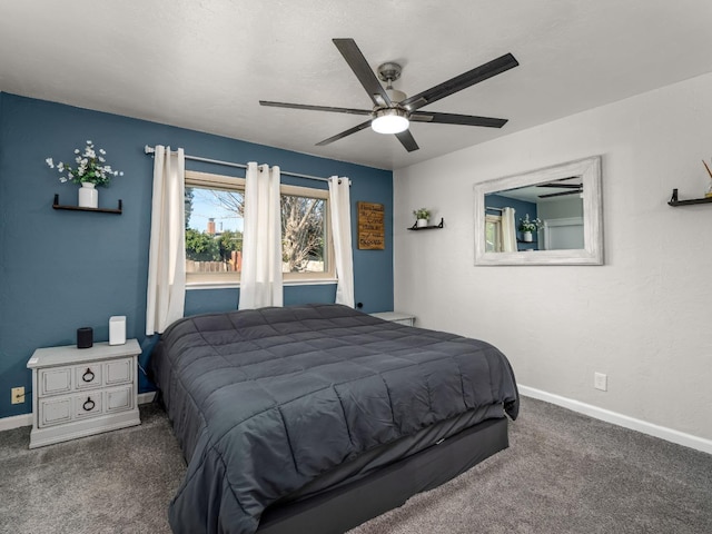 bedroom with carpet floors, baseboards, and a ceiling fan