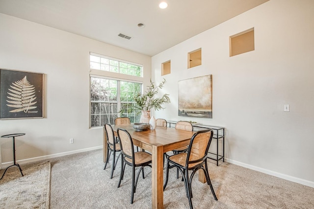 dining area with recessed lighting, baseboards, visible vents, and light colored carpet