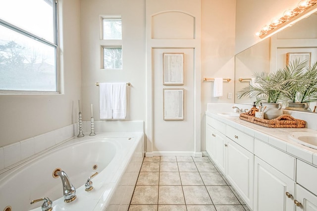 full bath featuring tile patterned flooring, a sink, a tub with jets, and double vanity