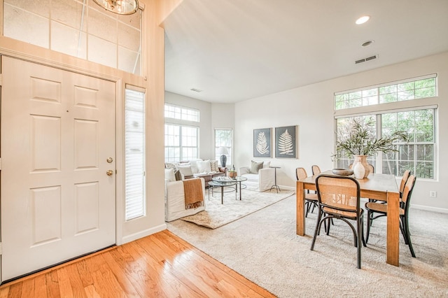 dining area with recessed lighting, wood finished floors, visible vents, and baseboards