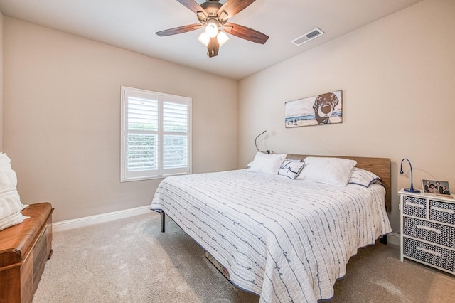 bedroom featuring ceiling fan, carpet, visible vents, and baseboards