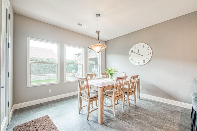 dining room featuring visible vents and baseboards