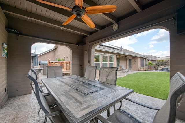 view of patio featuring a ceiling fan and outdoor dining space