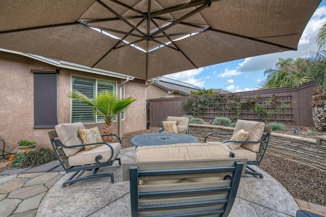 view of patio featuring fence