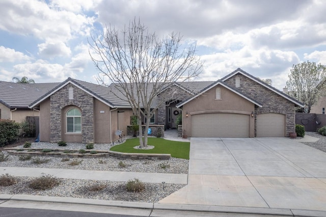 ranch-style house with a tile roof, stucco siding, an attached garage, stone siding, and driveway