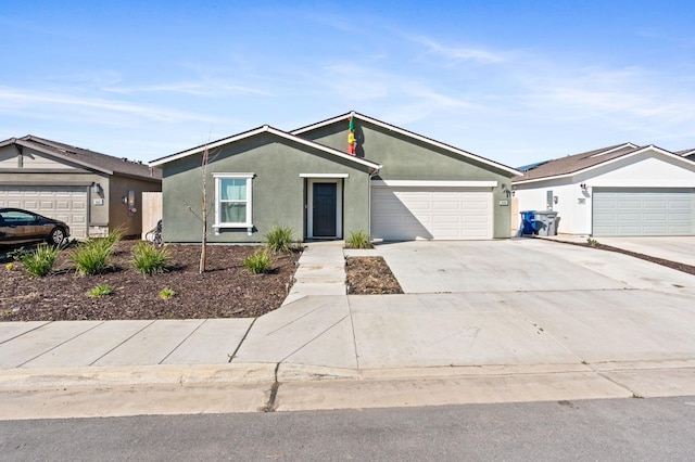 mid-century inspired home with a garage, concrete driveway, and stucco siding