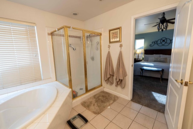 bathroom with ensuite bathroom, tile patterned flooring, a garden tub, a ceiling fan, and a shower stall