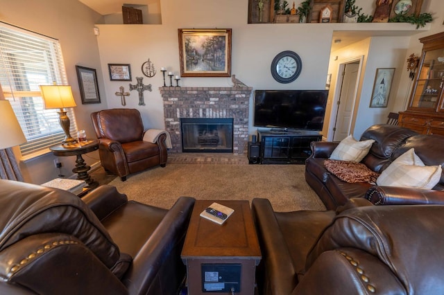 living area with carpet and a fireplace