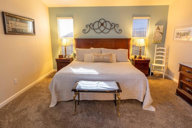 bedroom featuring carpet floors and baseboards