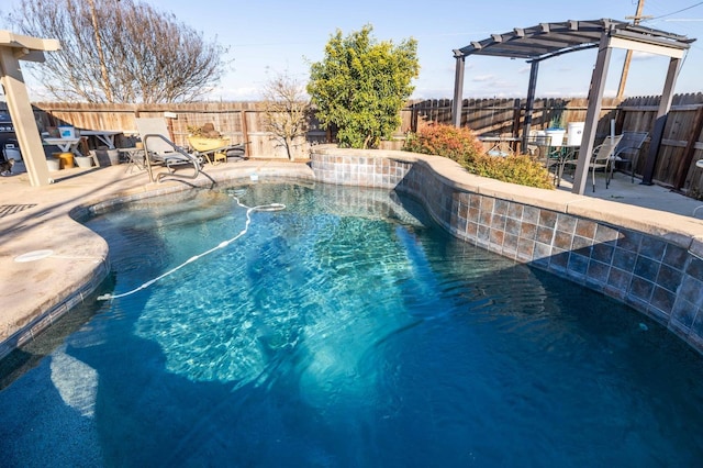 view of swimming pool with a patio area, a fenced backyard, and a pergola