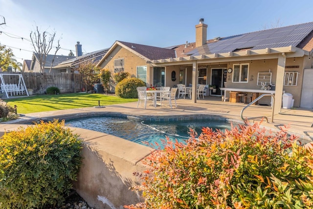 view of pool with a fenced in pool, a patio, fence, a yard, and outdoor dining space