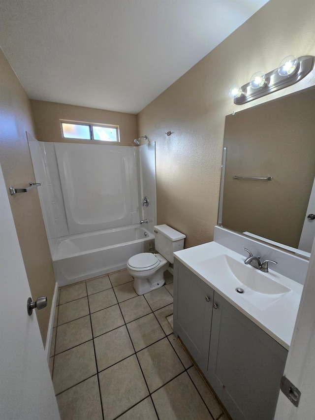 bathroom with shower / washtub combination, vanity, toilet, and tile patterned floors