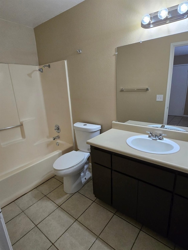 bathroom with tile patterned flooring, vanity, toilet, and bathing tub / shower combination