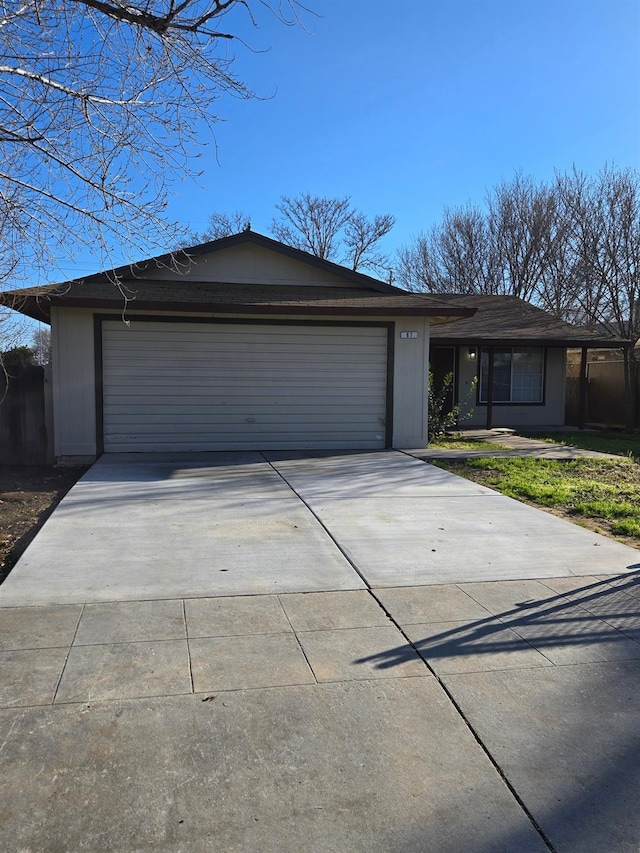 view of front of property featuring driveway and an attached garage