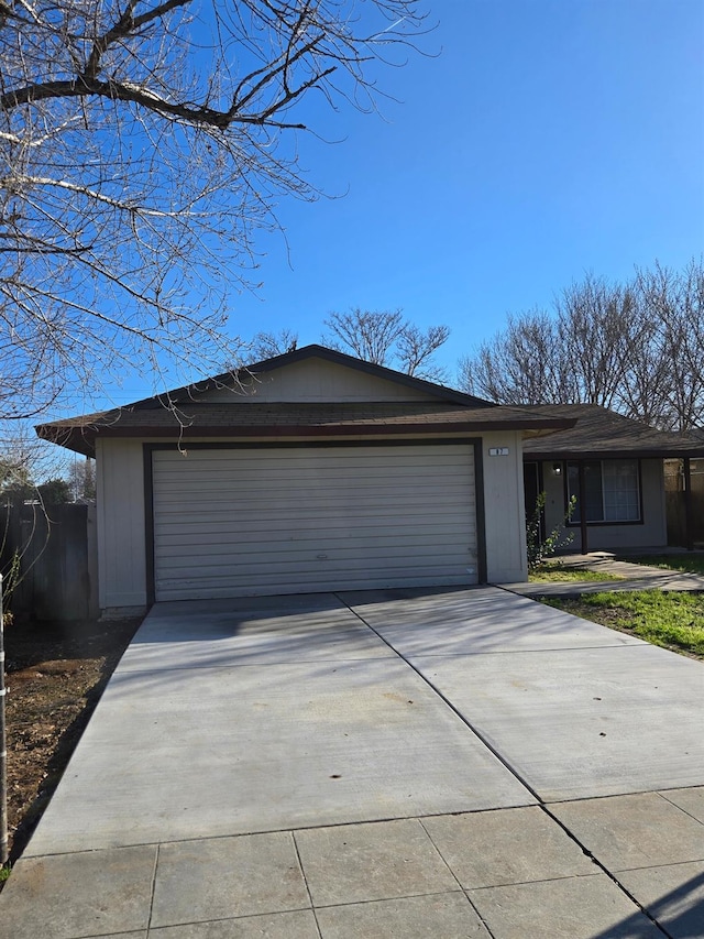 view of front of property featuring a garage and driveway