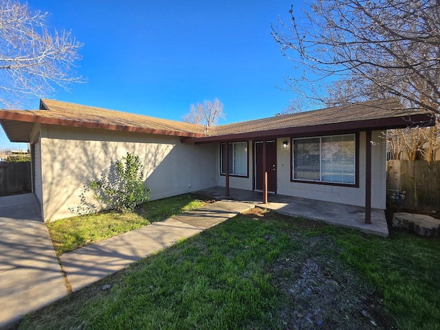 exterior space with a front lawn and fence