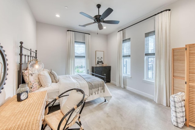 bedroom featuring light carpet, ceiling fan, recessed lighting, and baseboards