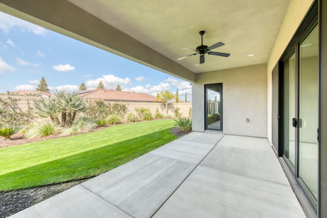 view of patio / terrace with a fenced backyard and a ceiling fan